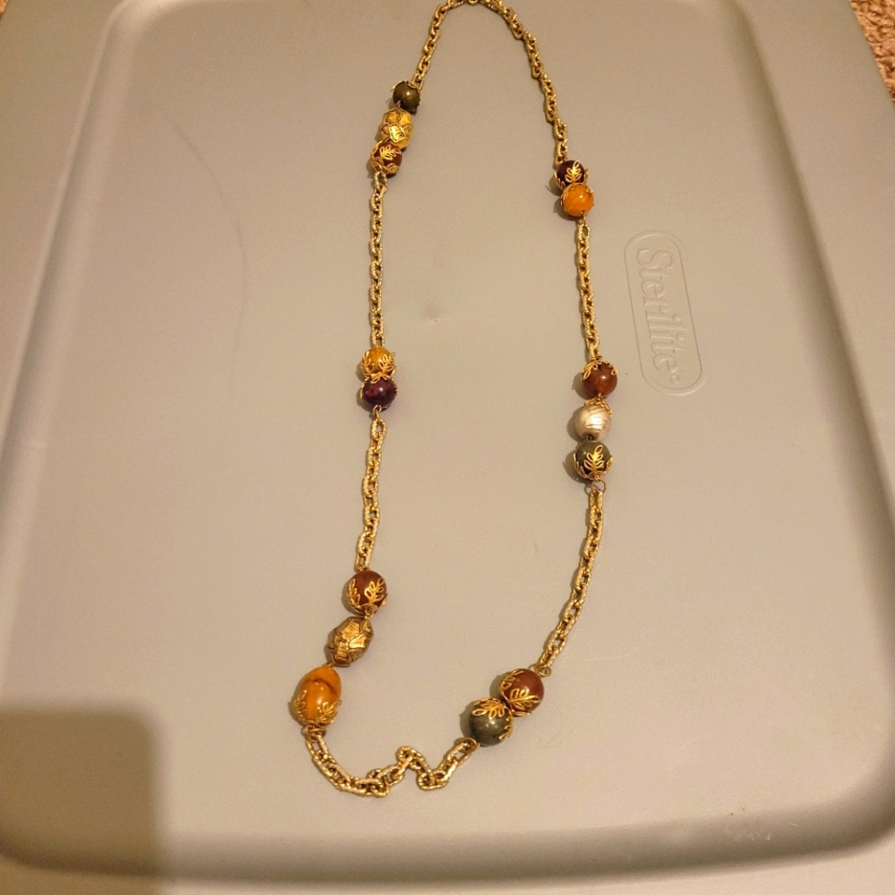 Necklace gold colored yellow and red balls